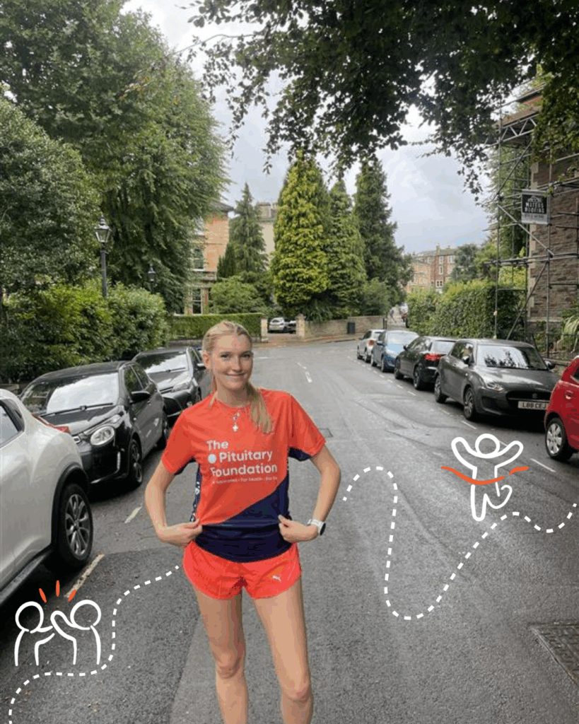 Nesta is wearing a bright orange pituitary foundation top and is out for a run