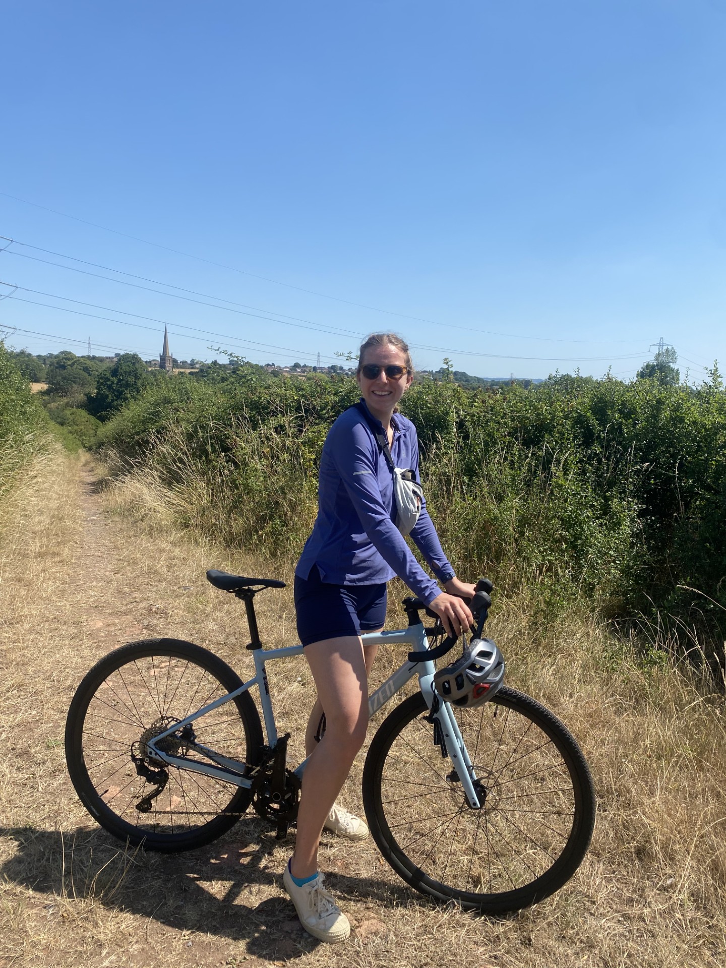 Amy riding a bike on a sunny day