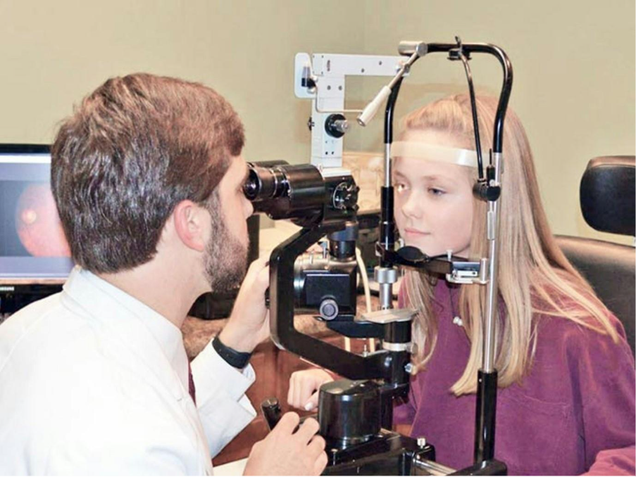 A young girl having an eye test 